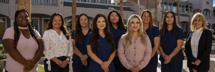 Group picture of staff with hands in front